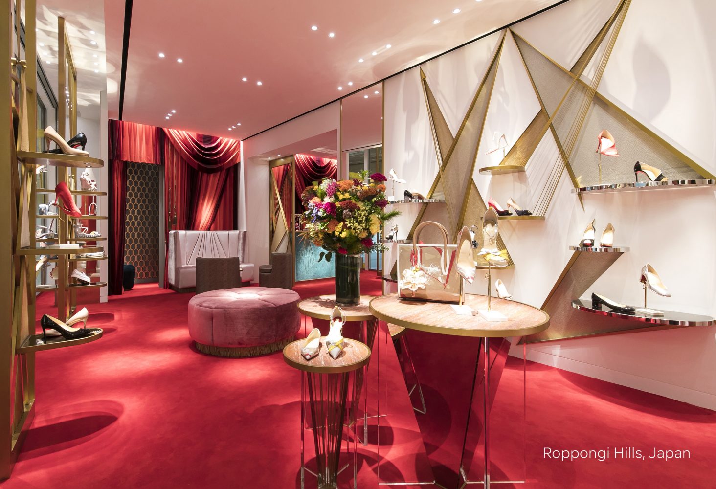 Seating area and shoe display found at Christian Louboutin concessions retail experience design, designed by Household.