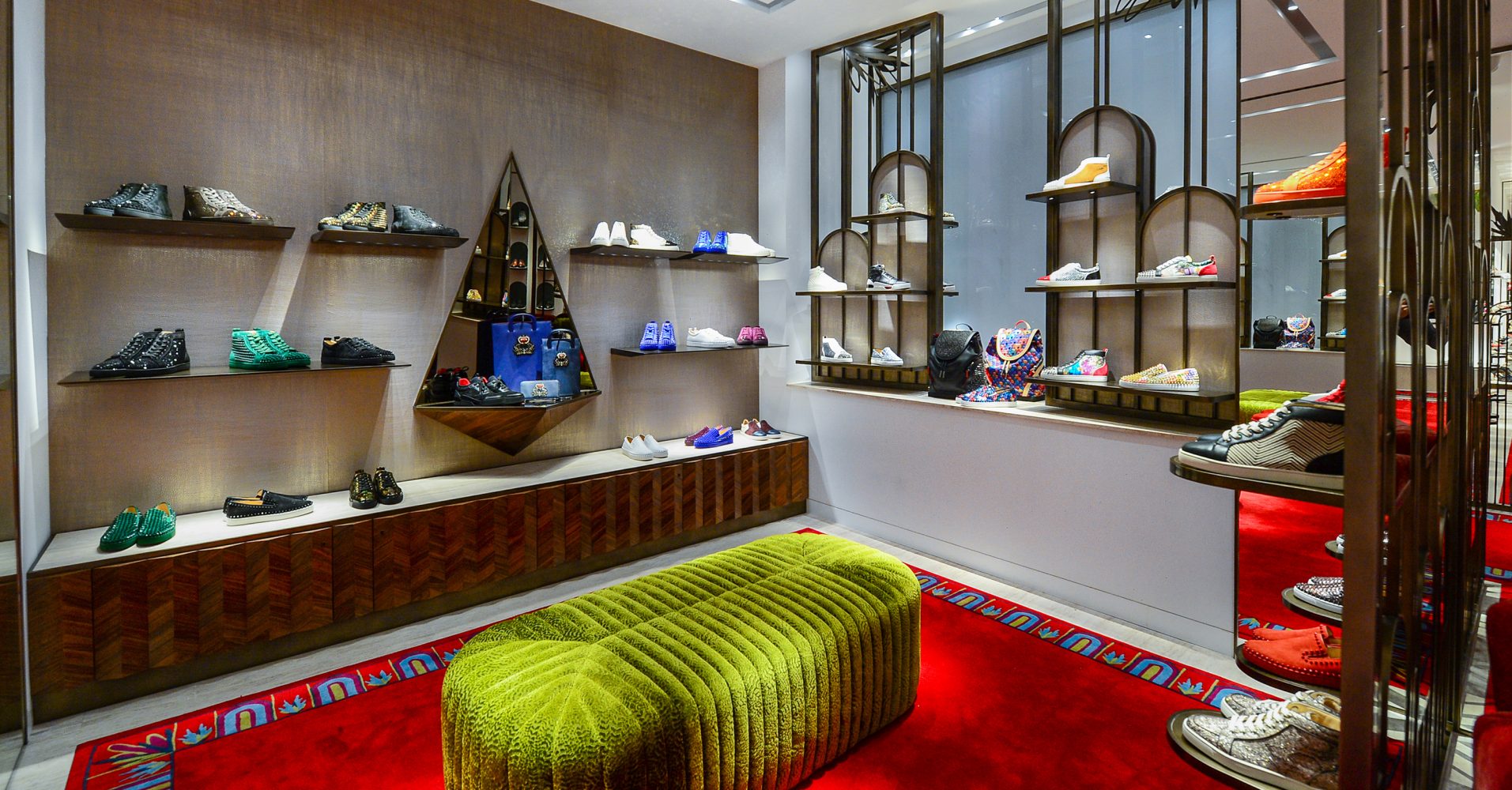 Seating area and shoe display found at Christian Louboutin concession, retail experience design, designed by Household.