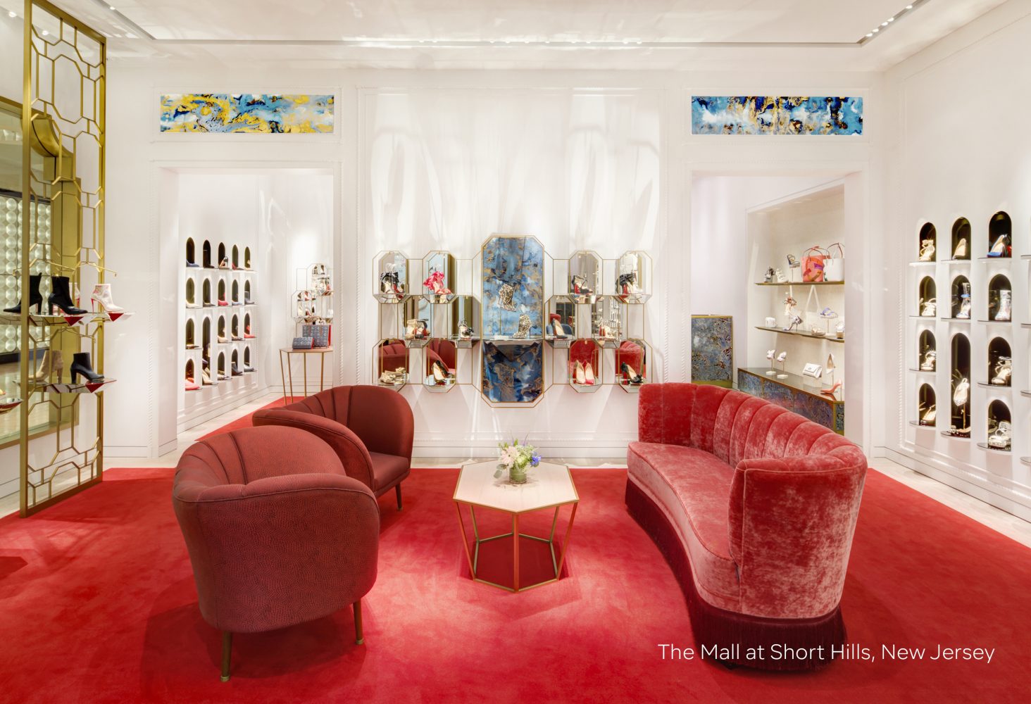 Seating area and shoe display found at Christian Louboutin concession, retail experience design, designed by Household.
